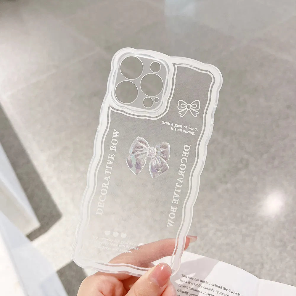 Transparent iPhone case with a raised 3D ice-through bow decoration on the back.