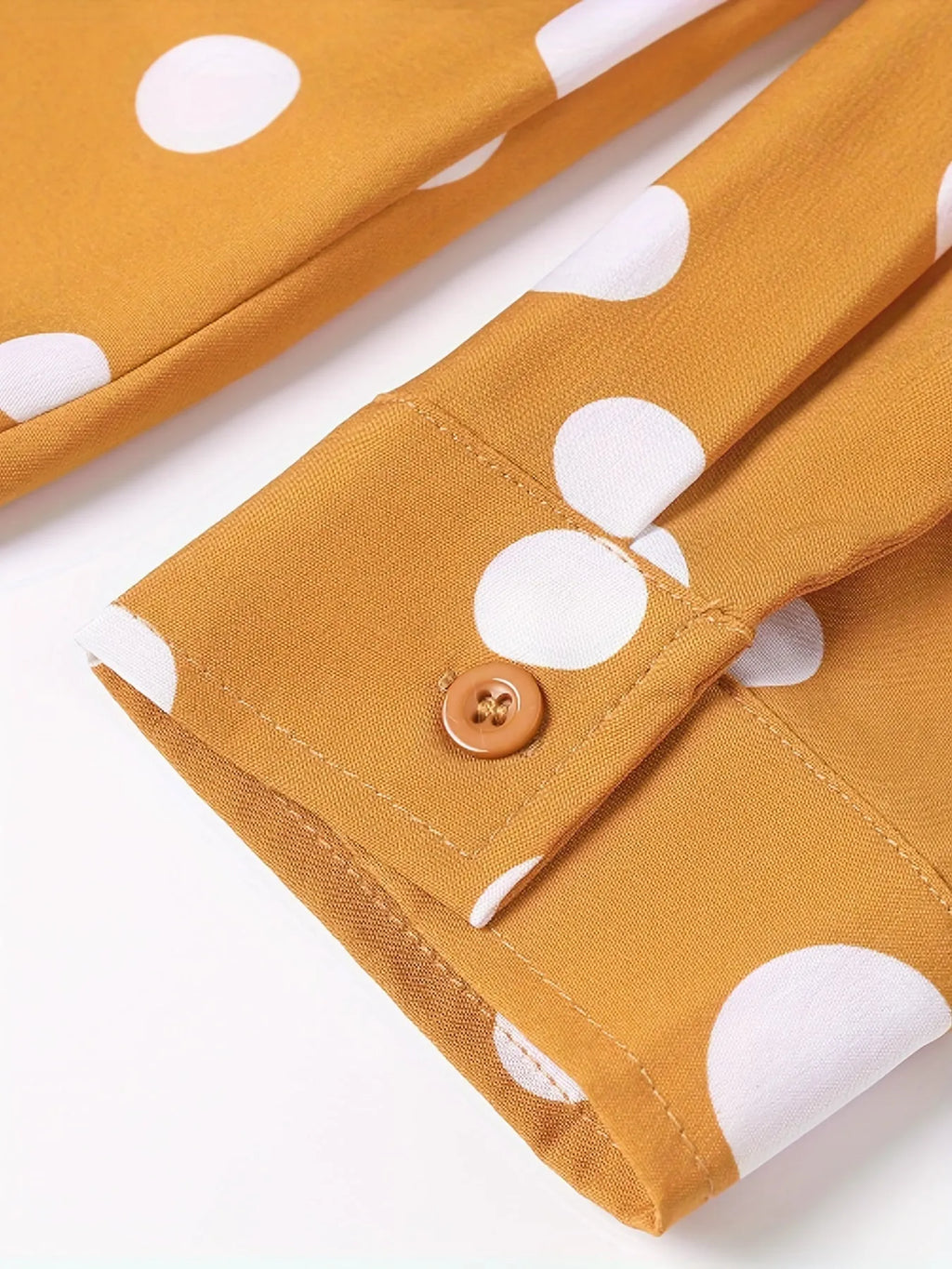 Men's warm orange long-sleeved shirt with white polka dot print and classic lapel collar