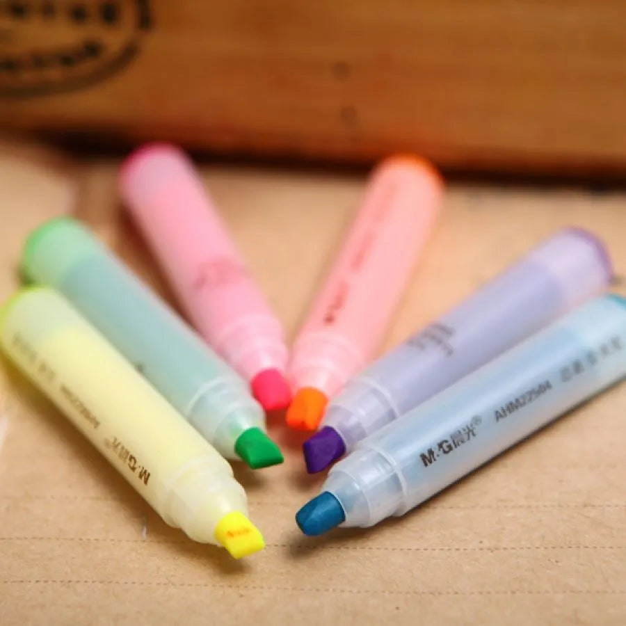 Six highlighter pens with slanted oblique shape in plastic casing showing different colours