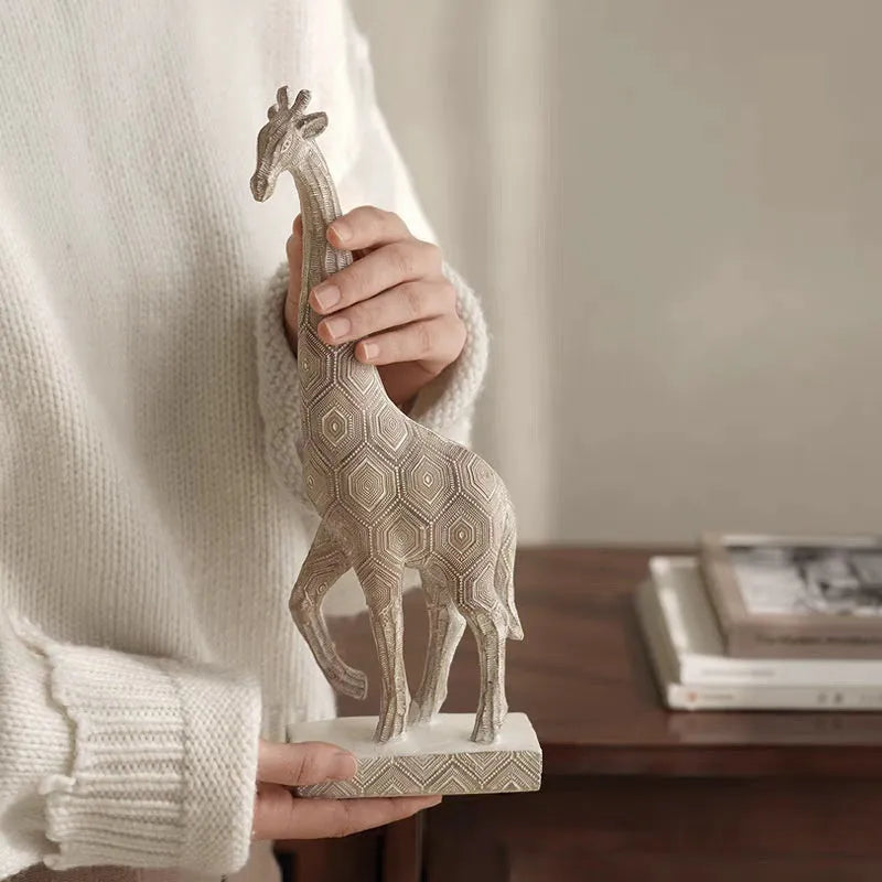 Wood-colour European-style resin giraffe decorative ornament on a shelf.