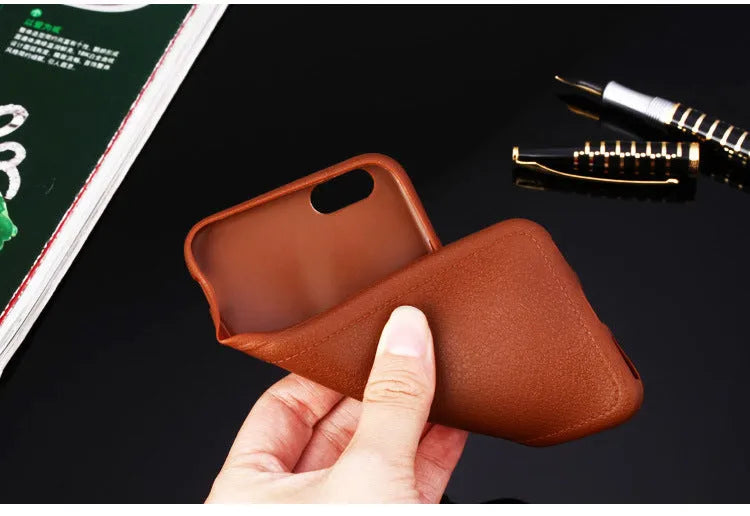 Genuine leather iPhone case with TPU interior in black, brown, navy blue, and wine red colours