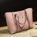 Brown retro-style women's messenger bag with top handle and shoulder strap, shown next to an A4 magazine for scale.