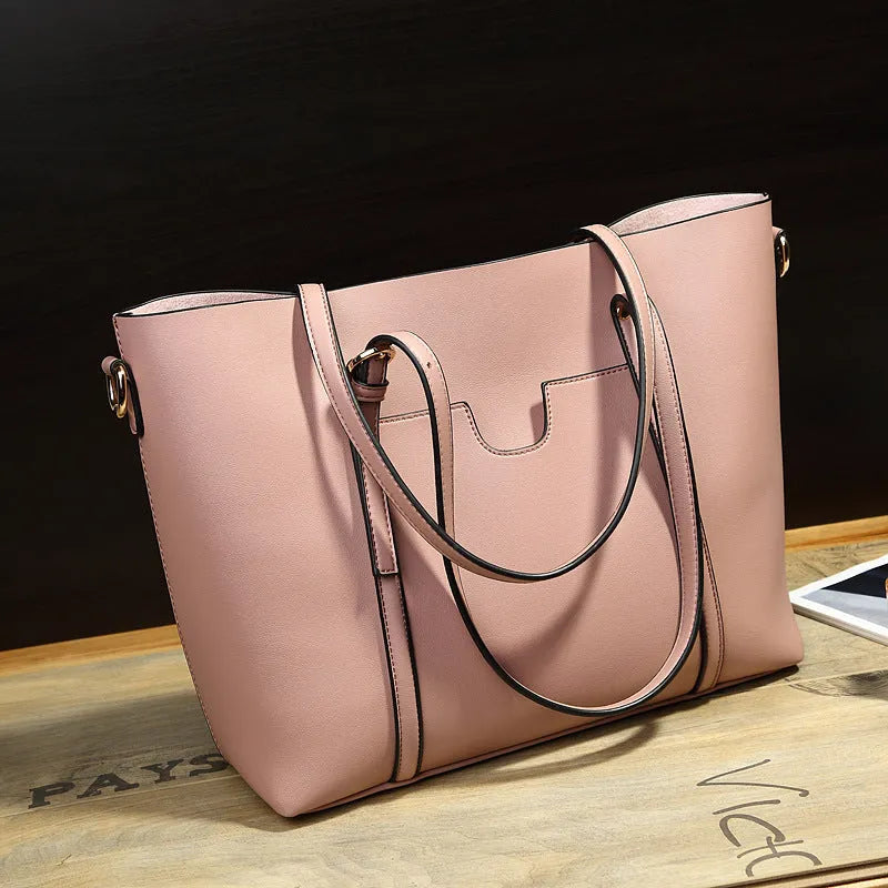Brown retro-style women's messenger bag with top handle and shoulder strap, shown next to an A4 magazine for scale.