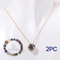 A natural stone beaded necklace and matching bracelet set on an adjustable cord.