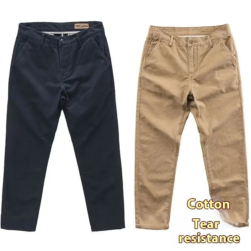 Man wearing slim-fit washed casual trousers in a neutral colour, showcasing the straight-leg style.