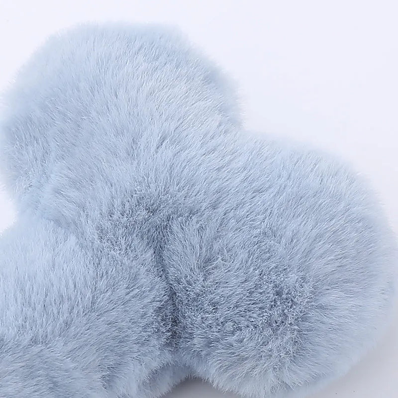 Blue love bone plush dog toy with vocal sound unit and squeaker for interactive chewing play.