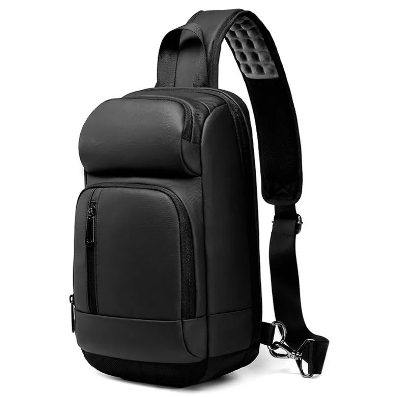 Black square PVC outdoor shoulder bag with an air cushion strap and zipper opening.