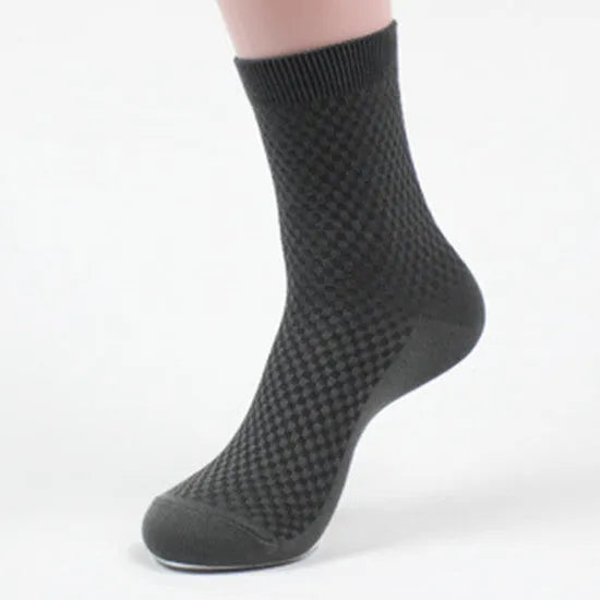 Pack of five men's bamboo fibre ankle socks in different colours, showing small square pattern.