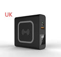 Super QI Power Bank with folding international plug in black, showing wireless charging surface and USB-C port.