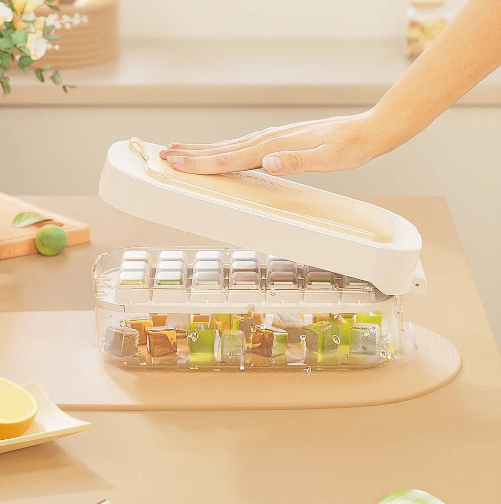 High-capacity ice cube tray ice box grid in blue with an ice shovel stored in its slot.