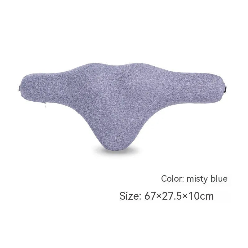 Dark grey memory foam car neck pillow resting on a car seat headrest.