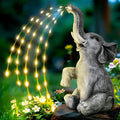 Resin elephant garden statue with integrated LED light strip for outdoor use.