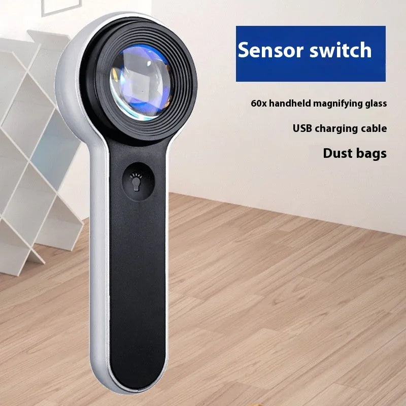 60x HD LED magnifying glass with USB charging in silver, showing illuminated lens and compact handheld design