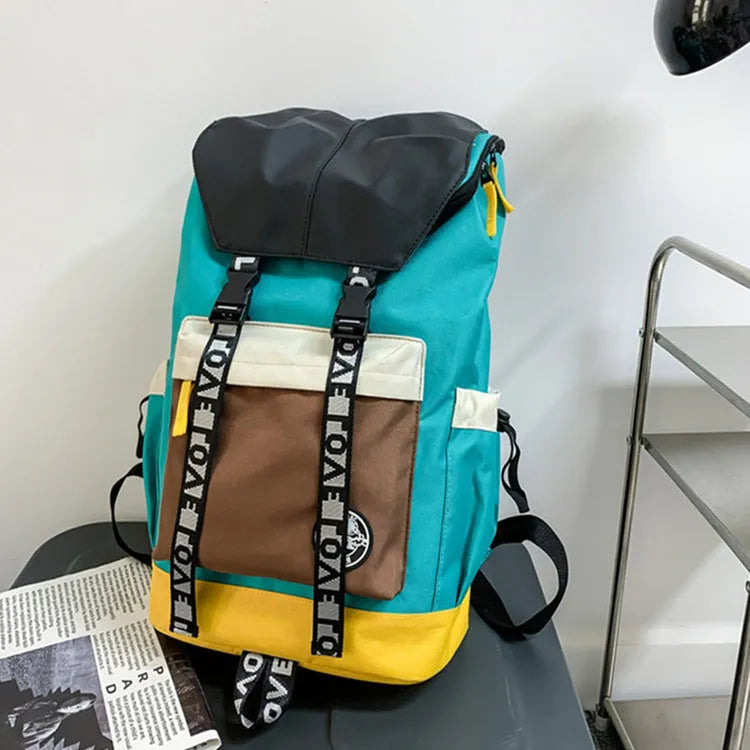 A black Oxford cloth backpack showing its size, carried over one shoulder.
