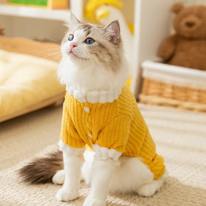 Yellow ribbed fleece pet jumpsuit with white ruffled cuffs and leash ring for cats and small dogs.
