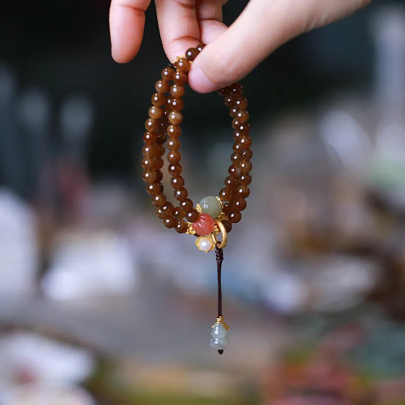 Brown jade Hetian jade three-ring bracelet with butterfly and gourd pearl design