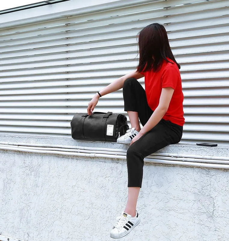 Black waterproof unisex sports fitness bag with diagonal straps and separate shoe compartments