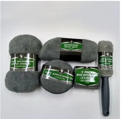 9-piece car wash cleaning kit with polyamide towels, sponge, tyre brush, and waxing cakes in dark grey and orange