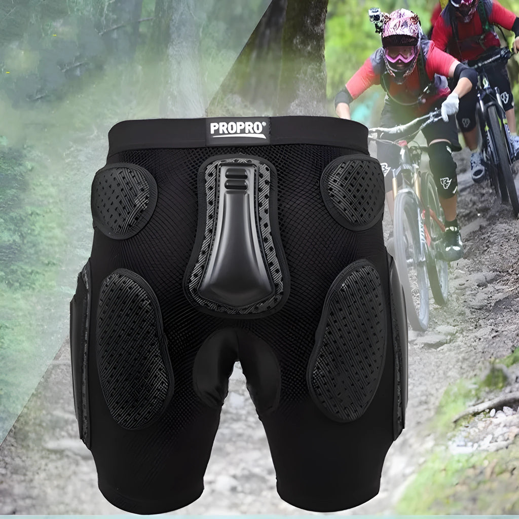 Black cycling protective pants with integrated hip pads, shown in size L for adult mountain bike or BMX use.