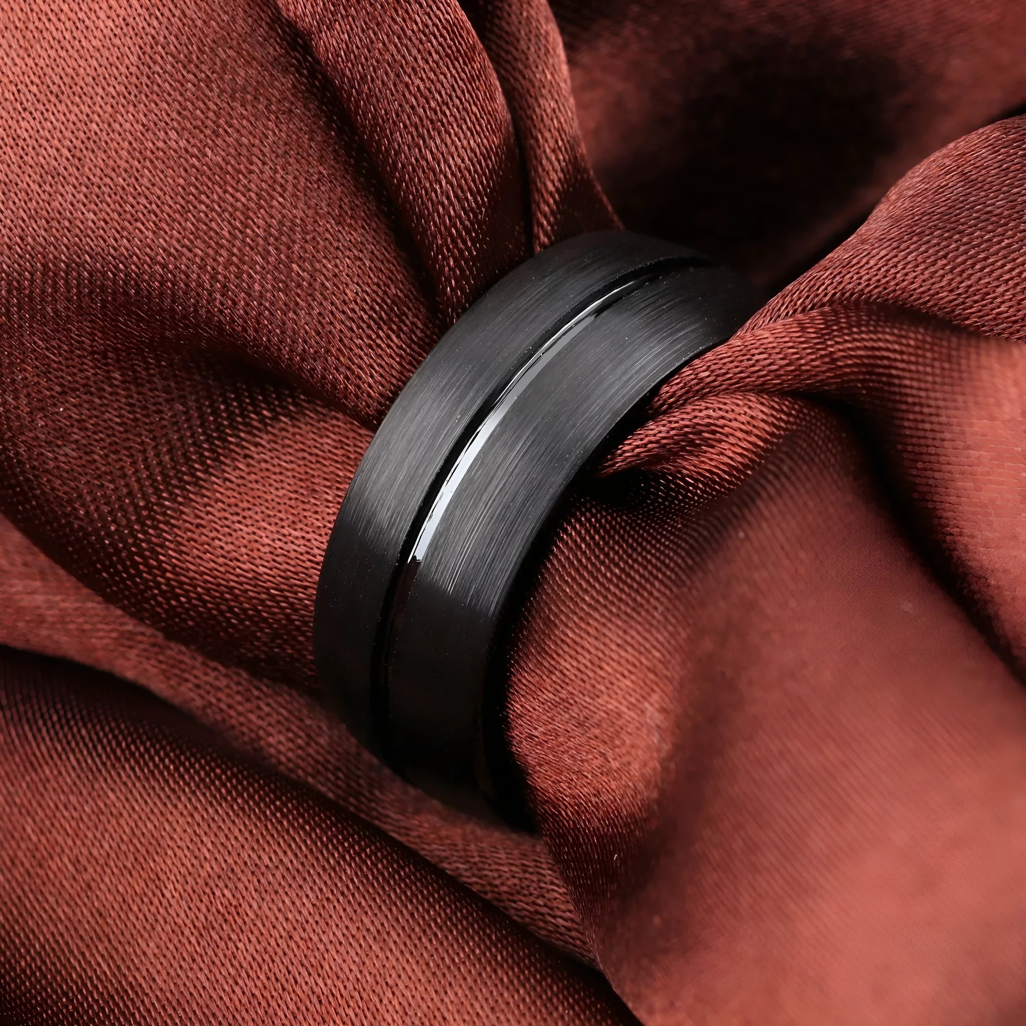 Black titanium steel ring with geometric design and alloy inlaid artificial stone on a dark background.