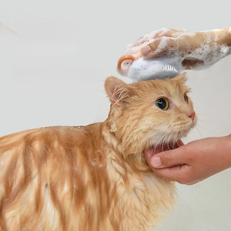 Orange TPR dog bath brush with shampoo dispenser and pumpkin-shaped grip