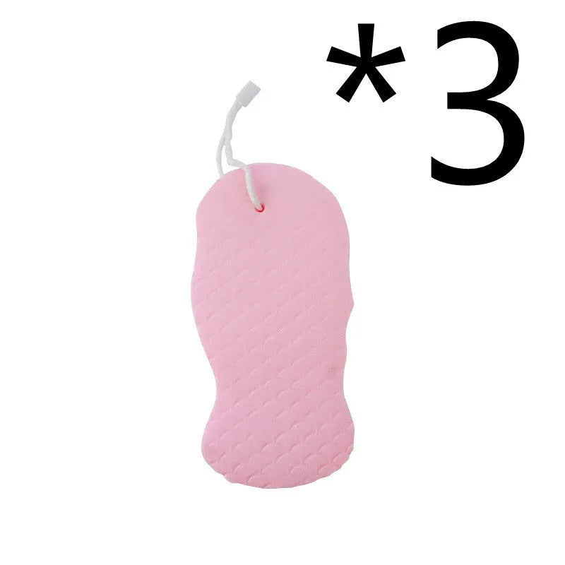 White 3D fish scale pattern bath sponge with hang loop on a bathroom background.