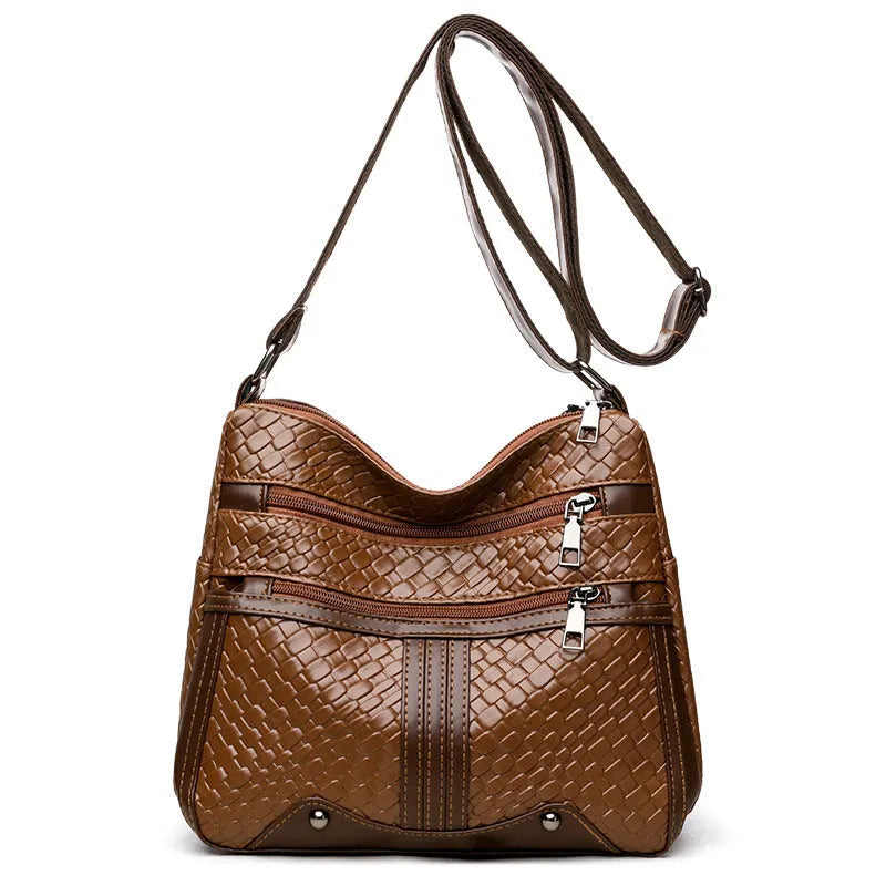 Woven PU messenger bag with single shoulder strap showing horizontal square shape and multiple compartments