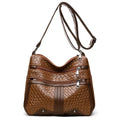 Woven PU messenger bag with single shoulder strap showing horizontal square shape and multiple compartments