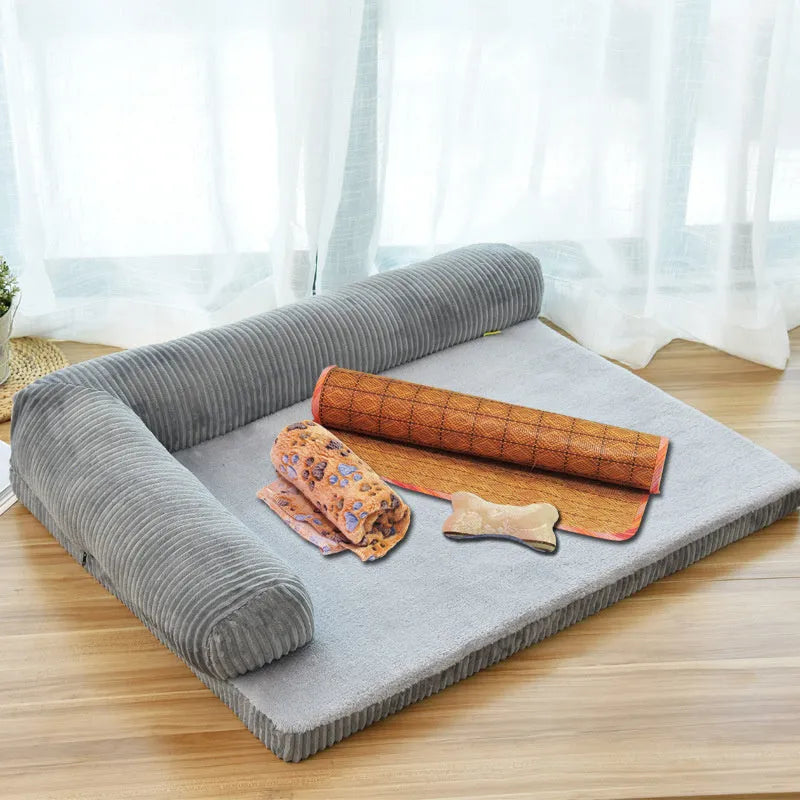 Large grey corduroy dog sofa bed with raised sides on a wooden floor