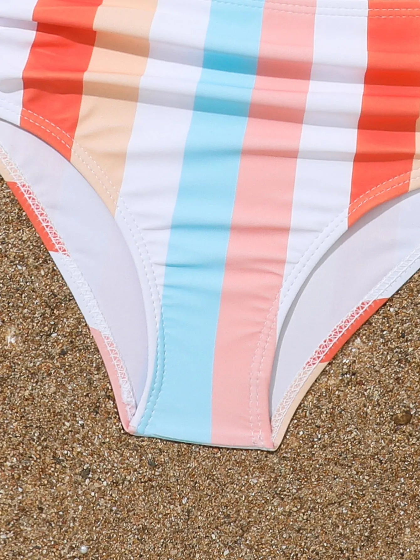 Girls' plaid print swimsuit briefs with polyester lining shown in multiple colour options