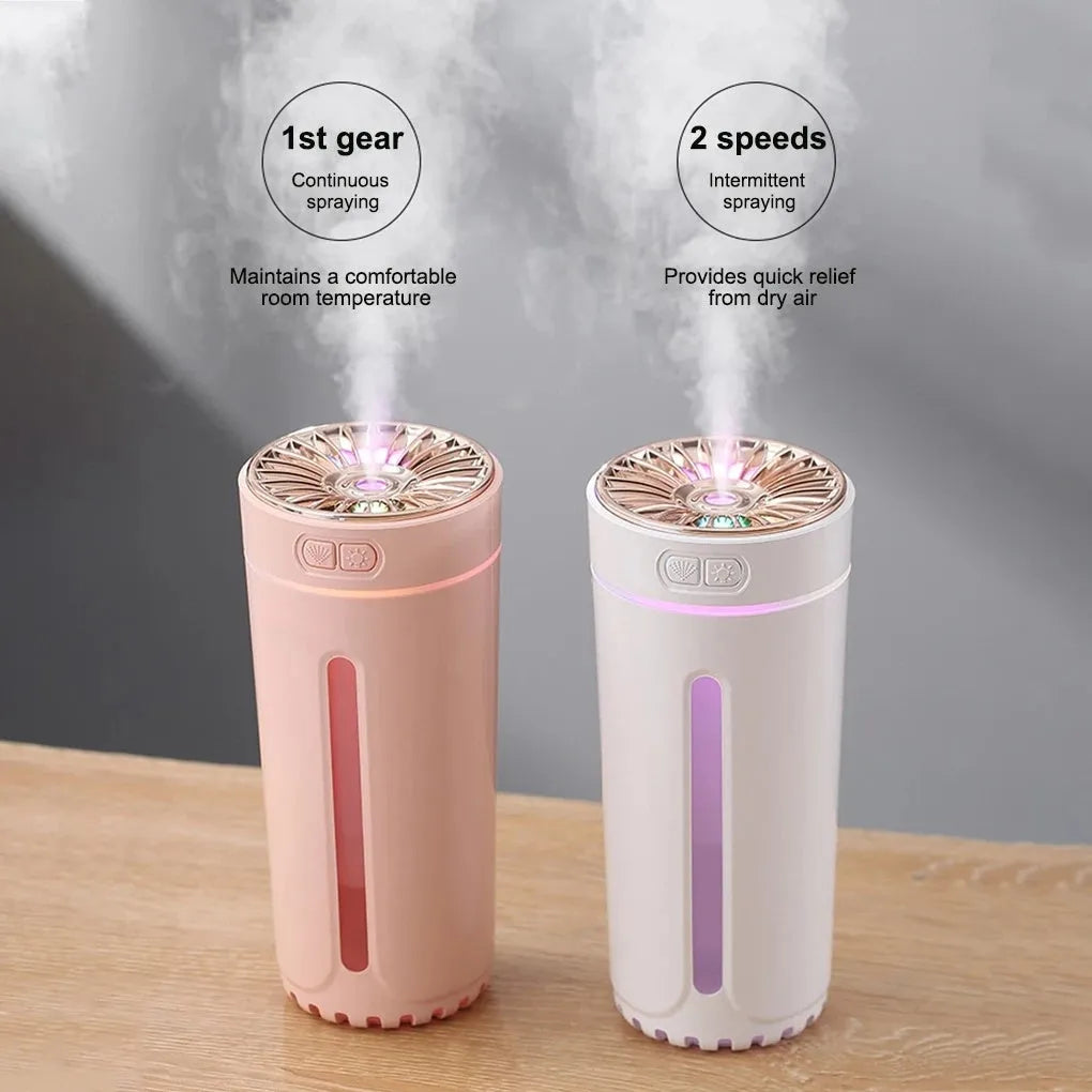 Black USB rechargeable car humidifier with colourful lights showing mist output, sized for cup holders