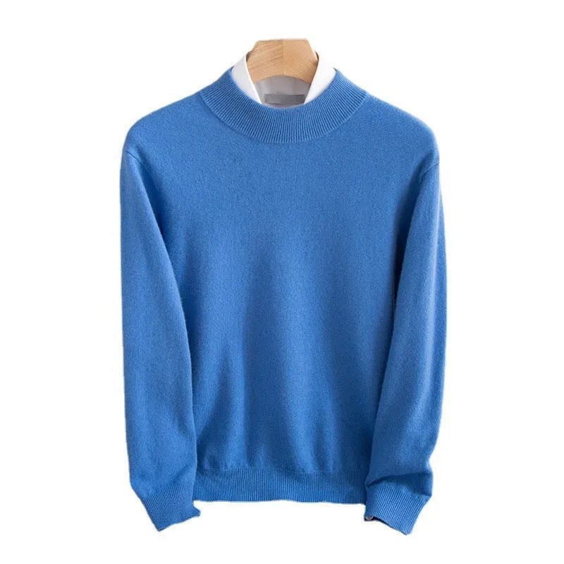 A man wearing a half-collar loose-fit wool sweater in a light business style, shown in a neutral colour.