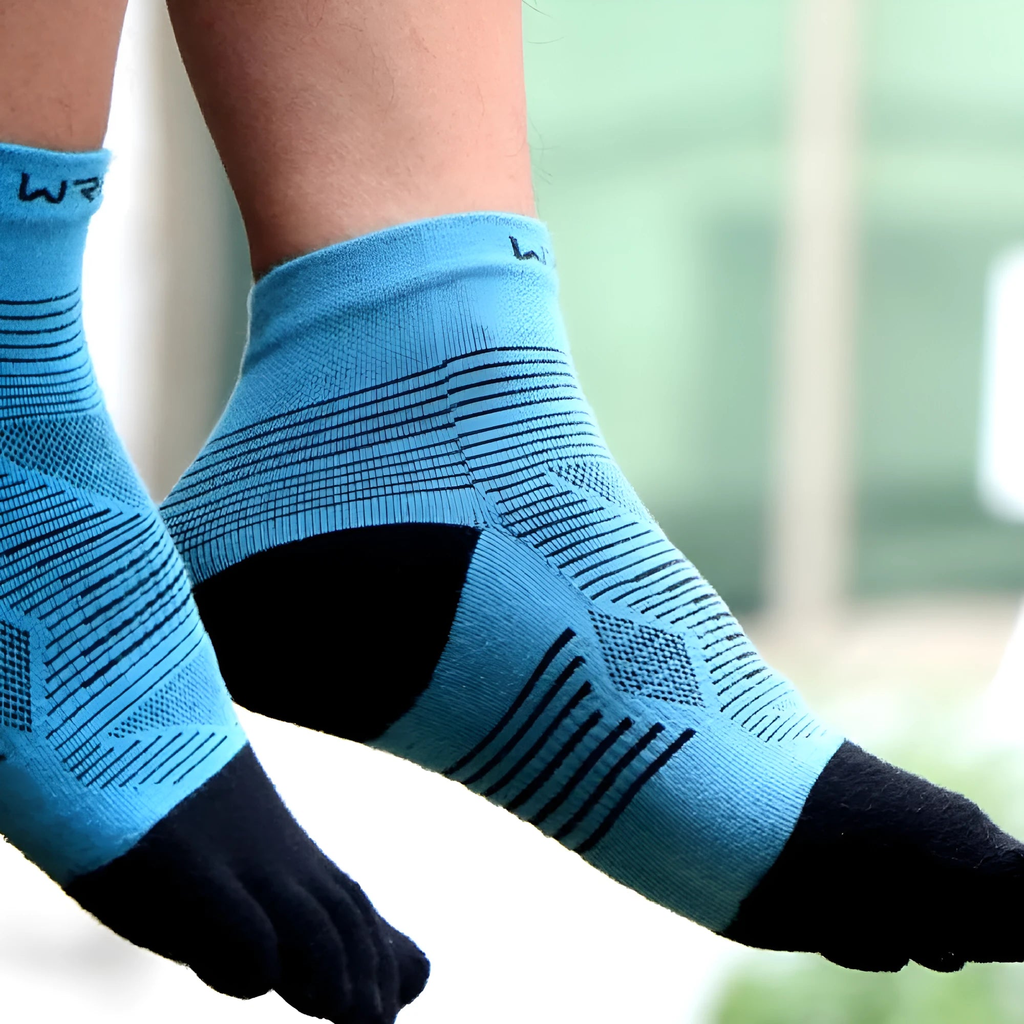 Professional sports toe socks in black and grey, made from COOLMAX, nylon, and Spandex fabric.