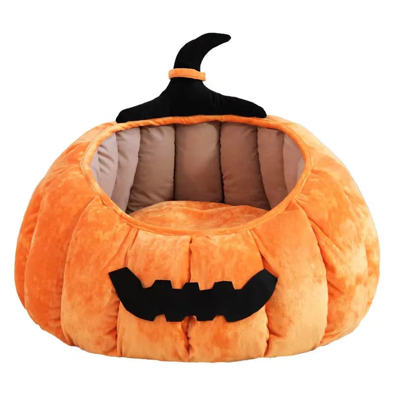 Halloween-themed orange pumpkin-shaped soft plush bed for a cat or small dog, featuring a cartoon devil design.