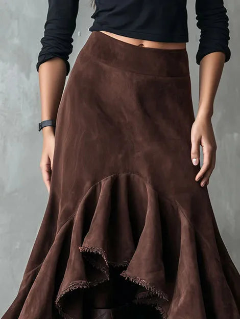 Brown women's high-low maxi skirt with a ruffle hem and textured eco suede finish.