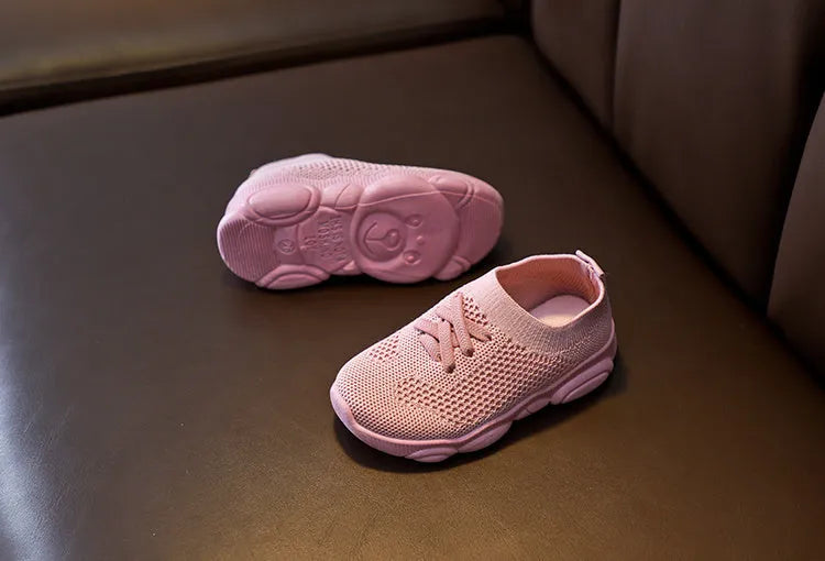 Children's lazy slip-on shoes in fabric with non-slip rubber sole, shown in available colours.