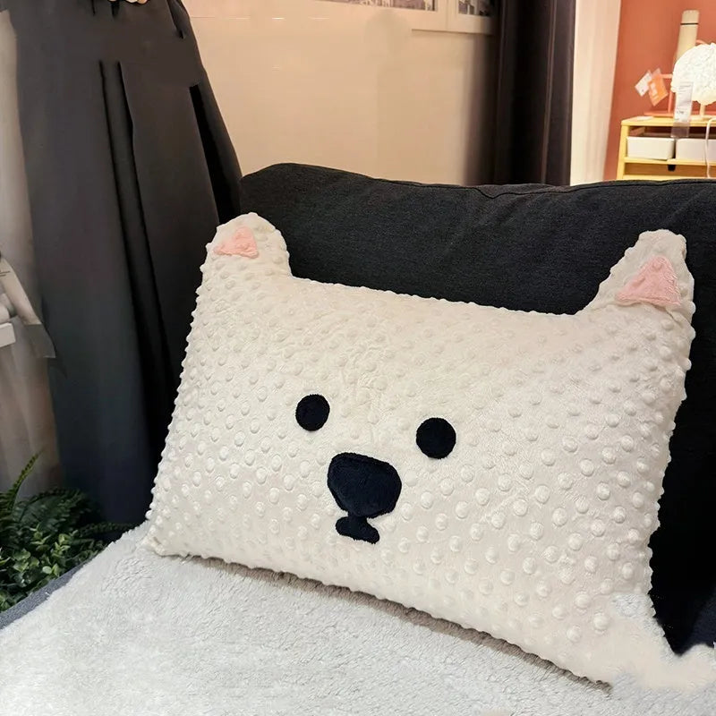 Grey and white West Highland puppy pillow dog cushion on a sofa.