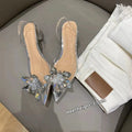 Women's high heels with transparent crystal flower decoration and pointed toe in microfiber
