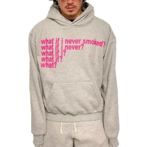 Black heavy hooded sweater with white letter print on chest, shown on a model.