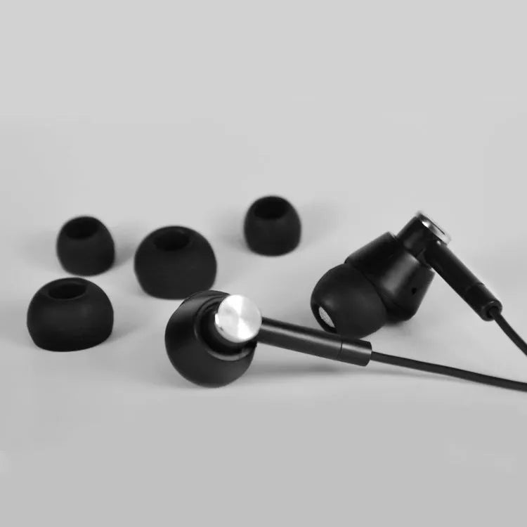 Black and white in-ear earphones with subwoofer for computer and mobile phone use
