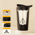 Black and silver electric protein shaker bottle with digital display and mixing blade inside