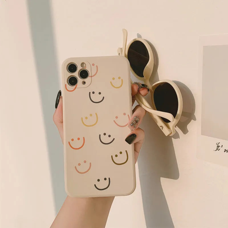 Simple Case Silicone iPhone case in graffiti design, showing Full Screen Smiley, Rainbow, and Watercolor colour options.