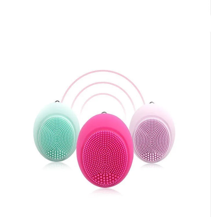 Ultrasonic electric face wash brush in pink with silicone brush head, compact design for deep pore cleansing