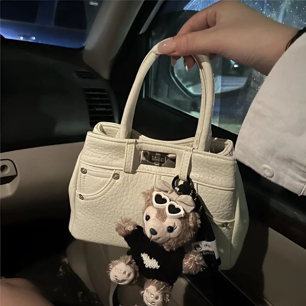 Women's denim shoulder bag in casual style with soft PU construction and polyester lining