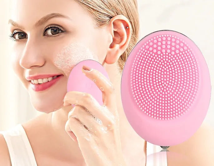 Ultrasonic electric face wash brush in pink with silicone brush head, compact design for deep pore cleansing