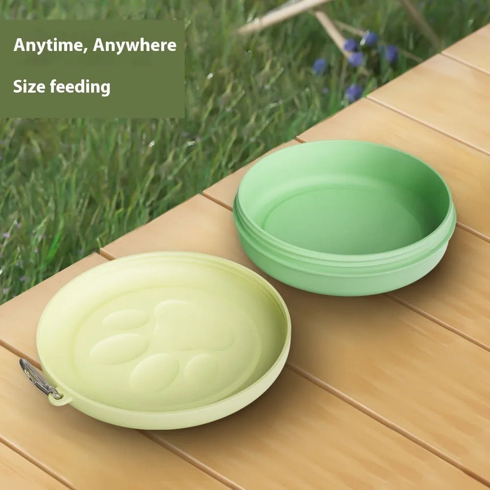 Portable plastic dog bowl in light pink and green, shown in small and large sizes for outdoor feeding.