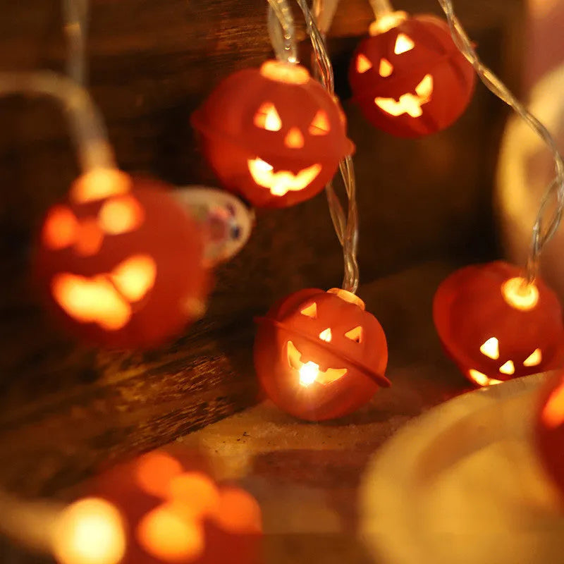 LED Halloween string lights with pumpkin-shaped iron pendants in warm white, 1.65m length with 10 lights displayed on a dark background