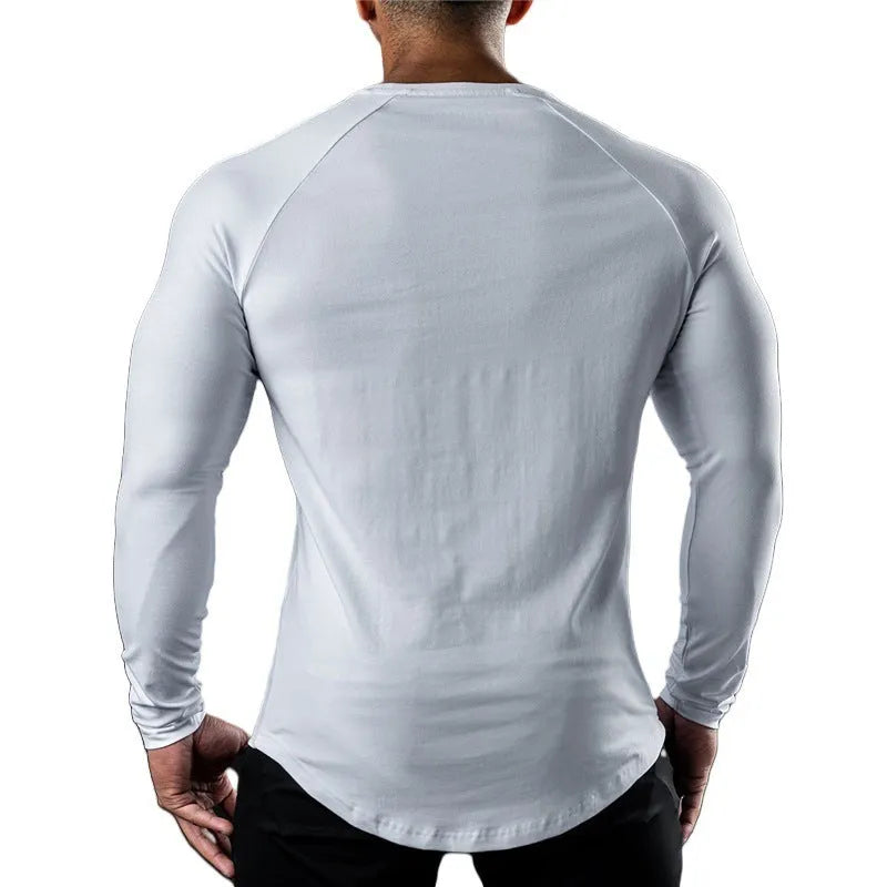 Men's tight-fitting long sleeve cotton sports T-shirt in grey, worn for gym training.