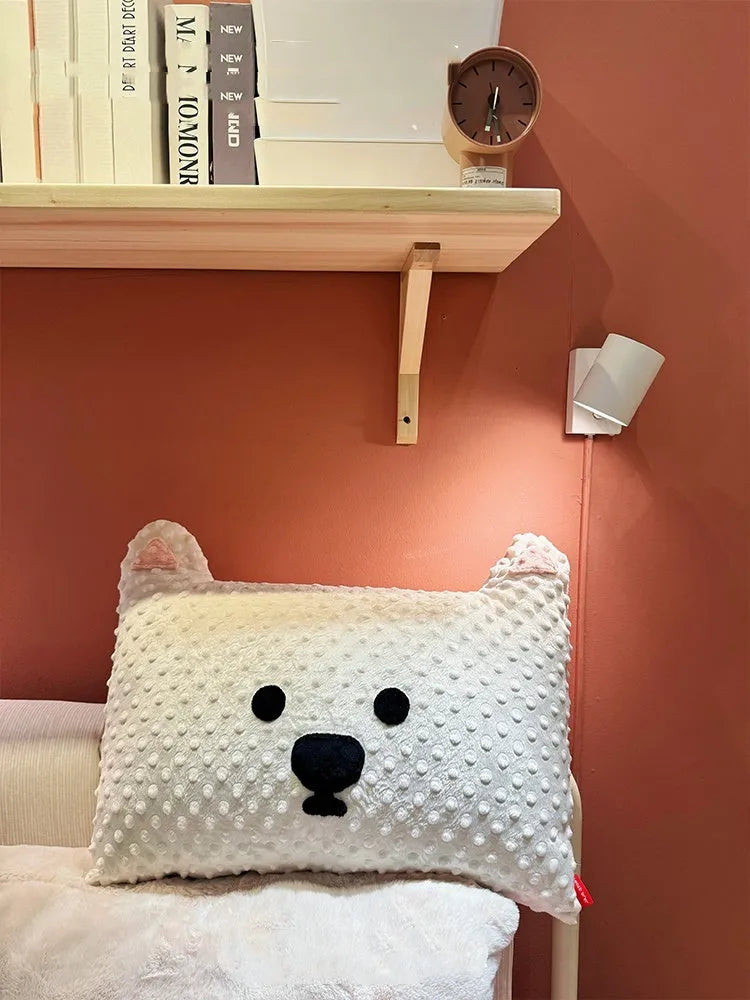 Grey and white West Highland puppy pillow dog cushion on a sofa.