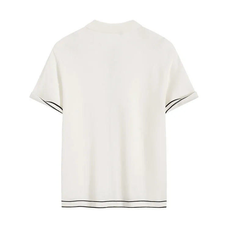 White short sleeve cardigan with dark contrast lapels, buttoned front, and a soft drape fabric.